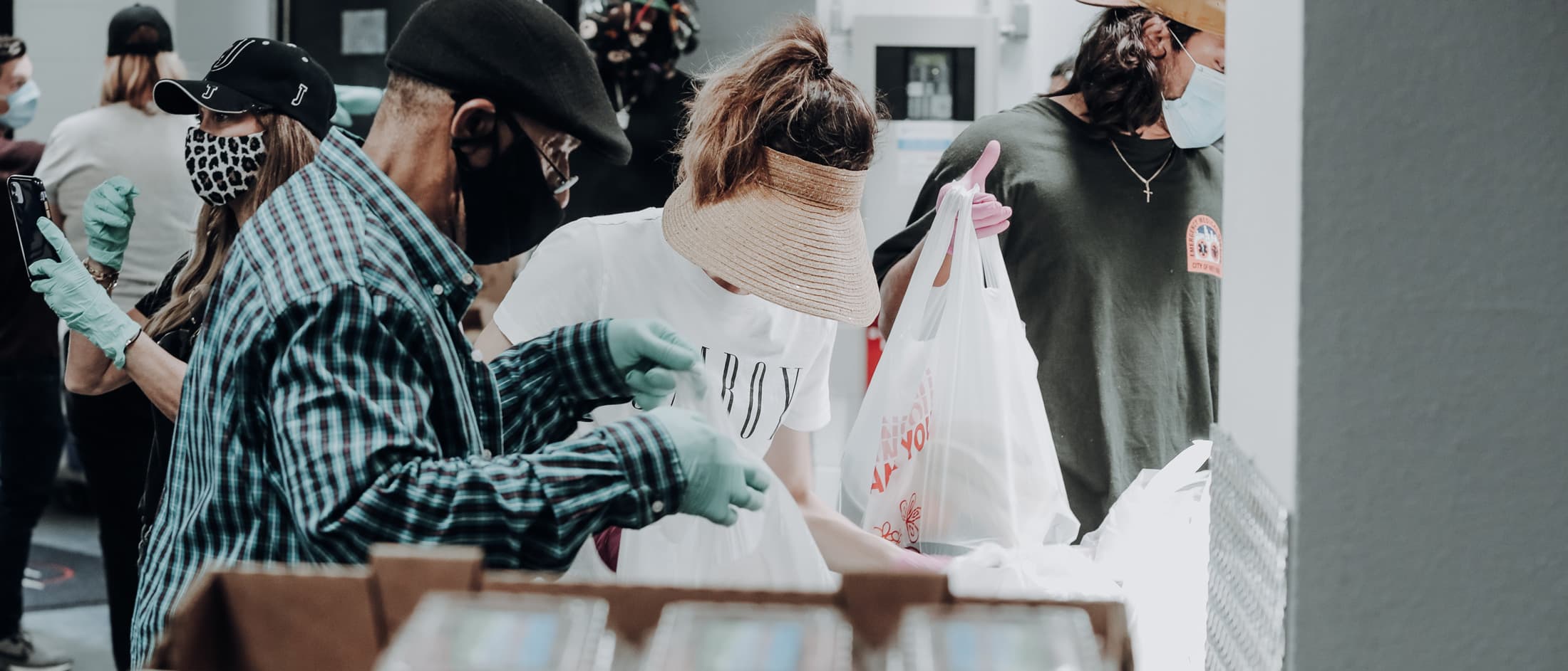 Group of people holding shopping bags