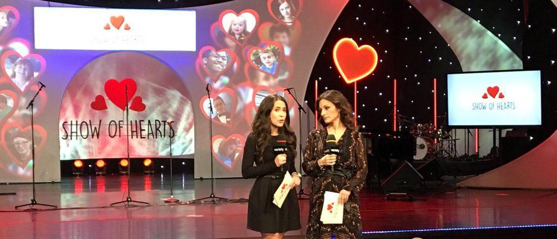 Two hosts talking for the Variety Show of Hearts Telethon
