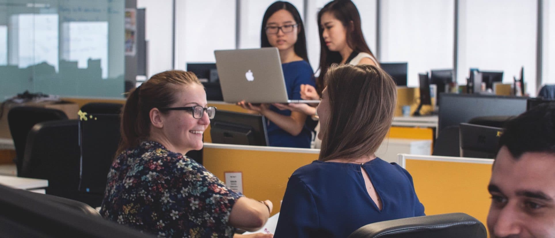 A group of people in an office.